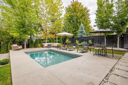 110-515 Wren Place, Kelowna, BC - Outdoor With In Ground Pool With Backyard