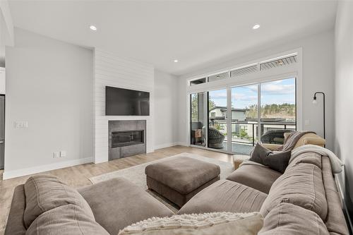 1901 Northern Flicker Court, Kelowna, BC - Indoor Photo Showing Living Room With Fireplace