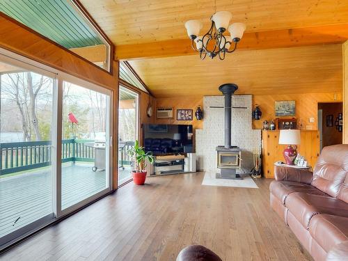 Salon - 56 Ch. Du Canari, Val-Des-Monts, QC - Indoor Photo Showing Living Room With Fireplace