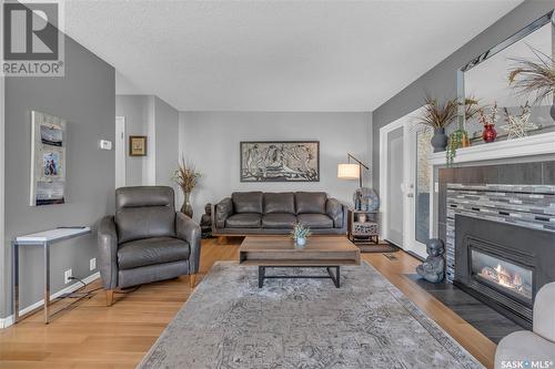 5028 Newport Road, Regina, SK - Indoor Photo Showing Living Room With Fireplace