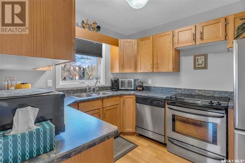 5028 Newport Road, Regina, SK - Indoor Photo Showing Kitchen With Stainless Steel Kitchen With Double Sink