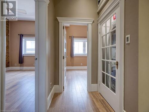 Hallway with a wealth of natural light and light hardwood / wood-style flooring - 151 Thames Street S, Ingersoll, ON 