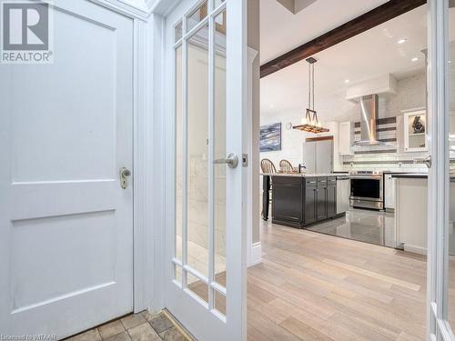 Bathroom with beamed ceiling, wood-type flooring, and backsplash - 151 Thames Street S, Ingersoll, ON 