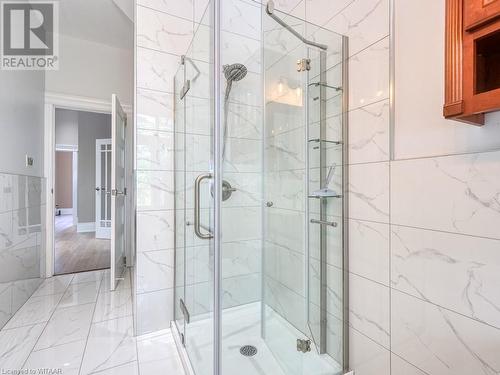 Bathroom featuring walk in shower and tile walls - 151 Thames Street S, Ingersoll, ON 