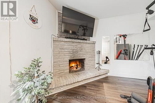 26 - 1155 Paramount Drive, Hamilton, ON - Indoor Photo Showing Living Room With Fireplace