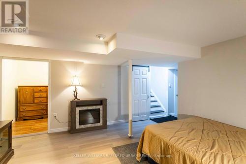 214 Sutherland Crescent, Cobourg, ON - Indoor Photo Showing Bedroom With Fireplace