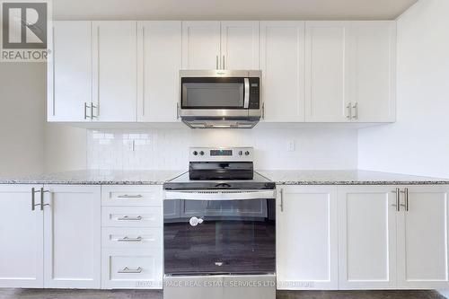 110 - 1573 Rose Way, Milton, ON - Indoor Photo Showing Kitchen