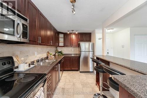 403 - 3120 Kirwin Avenue, Mississauga, ON - Indoor Photo Showing Kitchen With Stainless Steel Kitchen With Double Sink