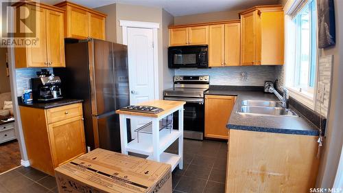 10207 Ross Crescent, North Battleford, SK - Indoor Photo Showing Kitchen With Double Sink