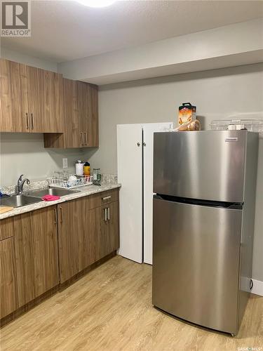 218 Veltkamp Lane, Saskatoon, SK - Indoor Photo Showing Kitchen With Double Sink