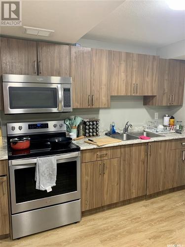 218 Veltkamp Lane, Saskatoon, SK - Indoor Photo Showing Kitchen With Double Sink