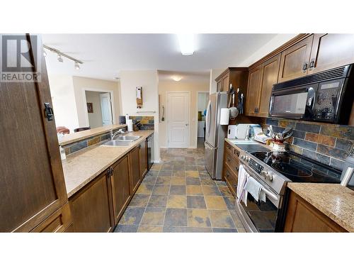 4874 Stanley Street Unit# 204, Radium Hot Springs, BC - Indoor Photo Showing Kitchen With Double Sink