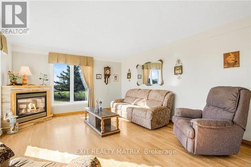 590 Blue Corner Road, Alfred And Plantagenet, ON - Indoor Photo Showing Living Room With Fireplace