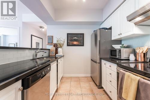 305 - 1 Deer Park Crescent, Toronto, ON - Indoor Photo Showing Kitchen With Double Sink