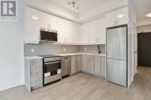 535 - 2343 Khalsa Gate, Oakville, ON - Indoor Photo Showing Kitchen With Upgraded Kitchen