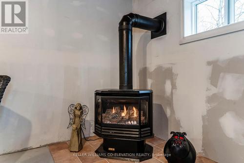 15 Mundy Avenue, Tiny, ON - Indoor With Fireplace