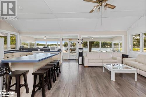 Sunroom / solarium featuring ceiling fan, plenty of natural light, and vaulted ceiling - 68 Wolverine Beach Rd, Port Severn, ON - Indoor Photo Showing Living Room