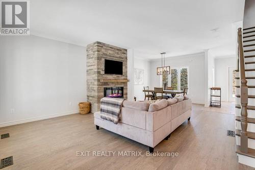 46 Jacquot Street, Champlain, ON - Indoor Photo Showing Living Room With Fireplace