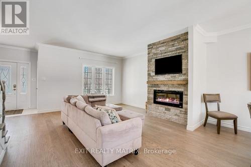 46 Jacquot Street, Champlain, ON - Indoor Photo Showing Living Room With Fireplace