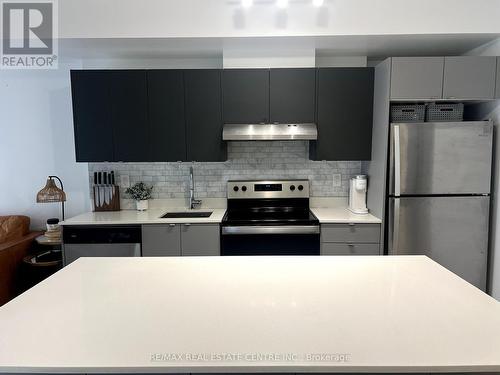 A703 - 3210 Dakota Common, Burlington, ON - Indoor Photo Showing Kitchen With Upgraded Kitchen