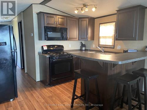 Cbl054 - 486 County Road 18, Prince Edward County, ON - Indoor Photo Showing Kitchen With Double Sink