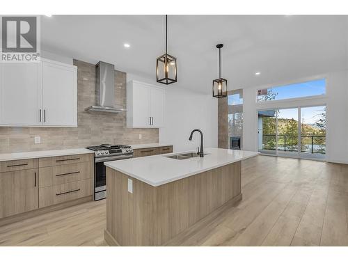 A 2-bed + den +flex room, 3-bath rancher walk-out - 2835 Canyon Crest Drive Unit# 2, West Kelowna, BC - Indoor Photo Showing Kitchen With Double Sink With Upgraded Kitchen