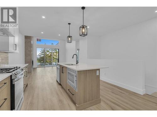 Large windows to showcase the views - 2835 Canyon Crest Drive Unit# 2, West Kelowna, BC - Indoor Photo Showing Kitchen With Upgraded Kitchen