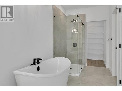 Soaker tub & glass shower - 2835 Canyon Crest Drive Unit# 2, West Kelowna, BC - Indoor Photo Showing Bathroom