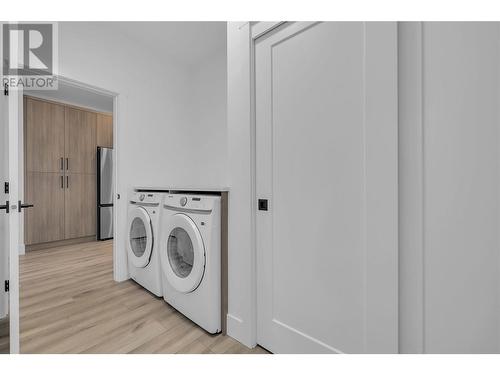 Laundry room with access to the garage - 2835 Canyon Crest Drive Unit# 2, West Kelowna, BC - Indoor Photo Showing Laundry Room