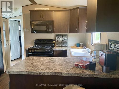 Pml013 - 486 County Road 18, Prince Edward County, ON - Indoor Photo Showing Kitchen With Double Sink