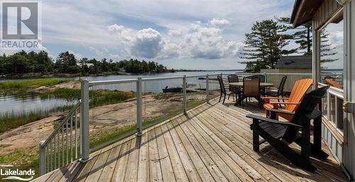 Wooden deck with a water view - 64 Wolverine Beach Road, Port Severn, ON - Outdoor