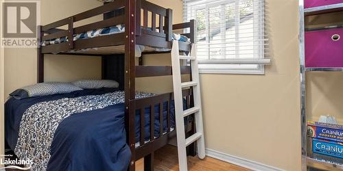 Bedroom featuring hardwood / wood-style flooring - 64 Wolverine Beach Road, Port Severn, ON - Indoor Photo Showing Bedroom