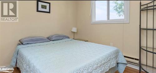 Bedroom with wood-type flooring - 64 Wolverine Beach Road, Port Severn, ON - Indoor Photo Showing Bedroom