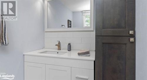 Bathroom featuring tasteful backsplash and vanity - 64 Wolverine Beach Road, Port Severn, ON - Indoor Photo Showing Bathroom