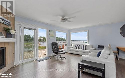 64 Wolverine Beach Road, Georgian Bay (Baxter), ON - Indoor Photo Showing Living Room With Fireplace