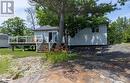 View of front of property featuring a deck - 64 Wolverine Beach Road, Port Severn, ON  - Outdoor With Deck Patio Veranda 