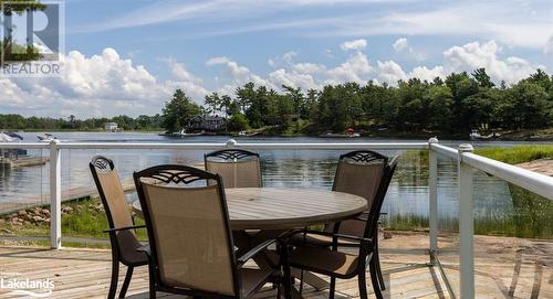 Deck with a water view - 64 Wolverine Beach Road, Port Severn, ON - Outdoor With Body Of Water With View