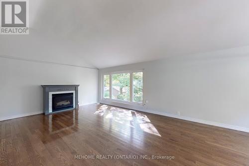 38 Cartier Crescent, Toronto, ON - Indoor Photo Showing Living Room With Fireplace