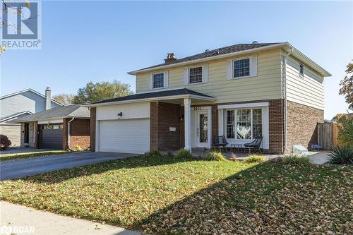 View of front property featuring a garage and a front yard - 2604 Homelands Drive, Mississauga, ON - Outdoor With Facade