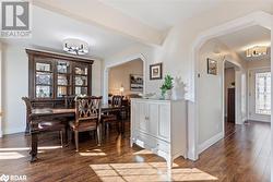 Dining area with hardwood / wood-style flooring and beamed ceiling - 