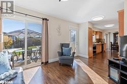 Living room featuring dark wood-type flooring - 