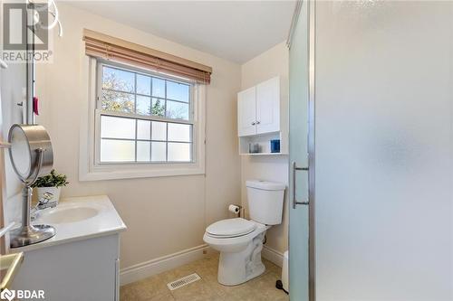 Bathroom featuring tile patterned flooring, vanity, toilet, and an enclosed shower - 2604 Homelands Drive, Mississauga, ON - Indoor Photo Showing Bathroom