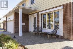 View of patio with a garage - 