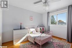 Bedroom featuring light wood-type flooring and ceiling fan - 