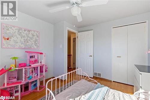 Bedroom with hardwood / wood-style flooring, ceiling fan, and a closet - 2604 Homelands Drive, Mississauga, ON - Indoor Photo Showing Bedroom