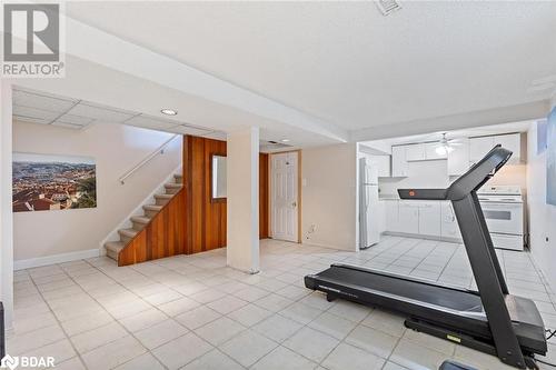 Workout area with ceiling fan and light tile patterned flooring - 2604 Homelands Drive, Mississauga, ON - Indoor