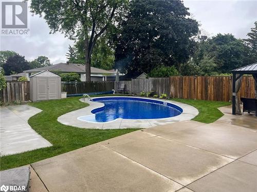 View of swimming pool featuring a shed, a lawn, a gazebo, and a patio area - 2604 Homelands Drive, Mississauga, ON - Outdoor With In Ground Pool With Backyard