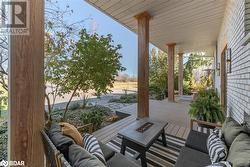 View of patio with an outdoor living space with a fire pit - 