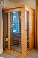 View of sauna / steam room featuring wooden walls and hardwood / wood-style floors - 