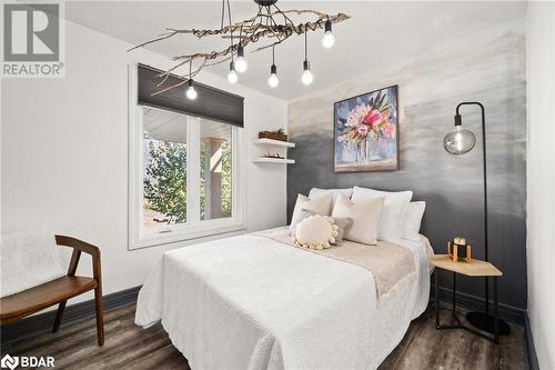 Bedroom featuring dark hardwood / wood-style floors - 18133 Loyalist Parkway, Prince Edward County, ON - Indoor Photo Showing Bedroom